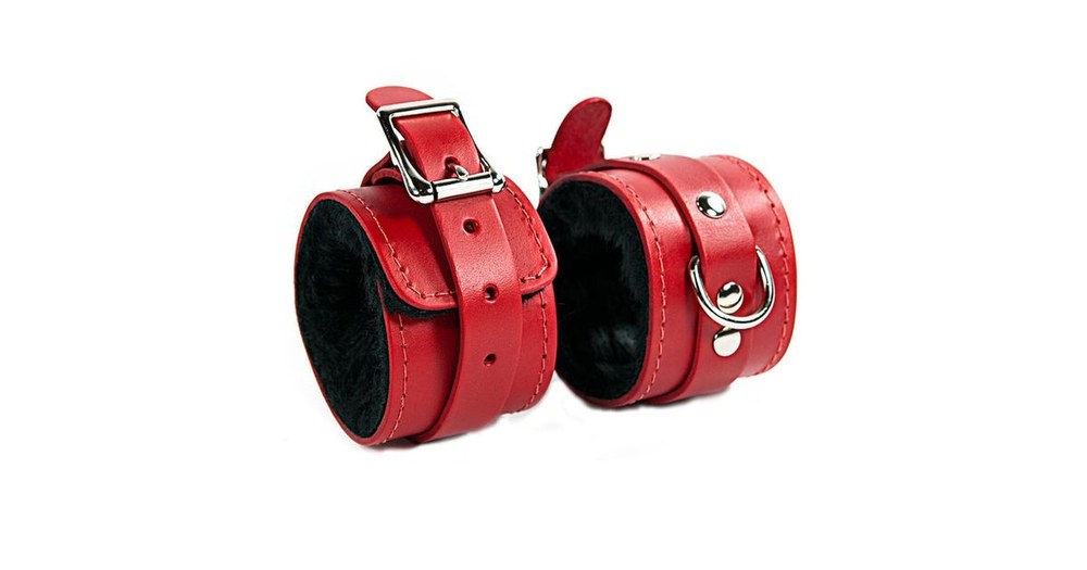 Pair of red BDSM handcuffs with faux fur, accessible Lovehoney-style range